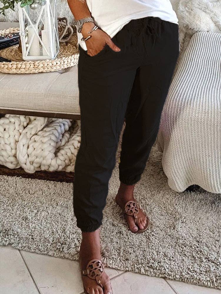 Solid Color Waist Tie Trousers from J&J SHOP ONLINE, made from 100% cotton with a casual fit and adjustable waist tie for a comfortable, stylish look.