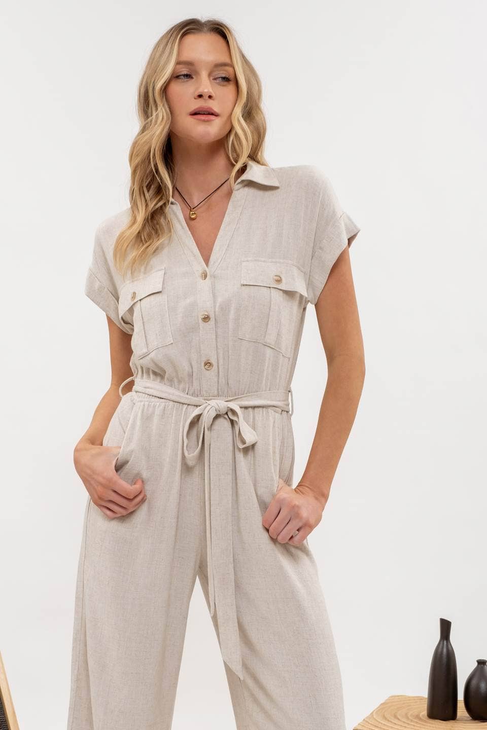 Angled view of Button Down Belted Wide Leg Jumpsuit from J&J Shop Online showing the full length and design.