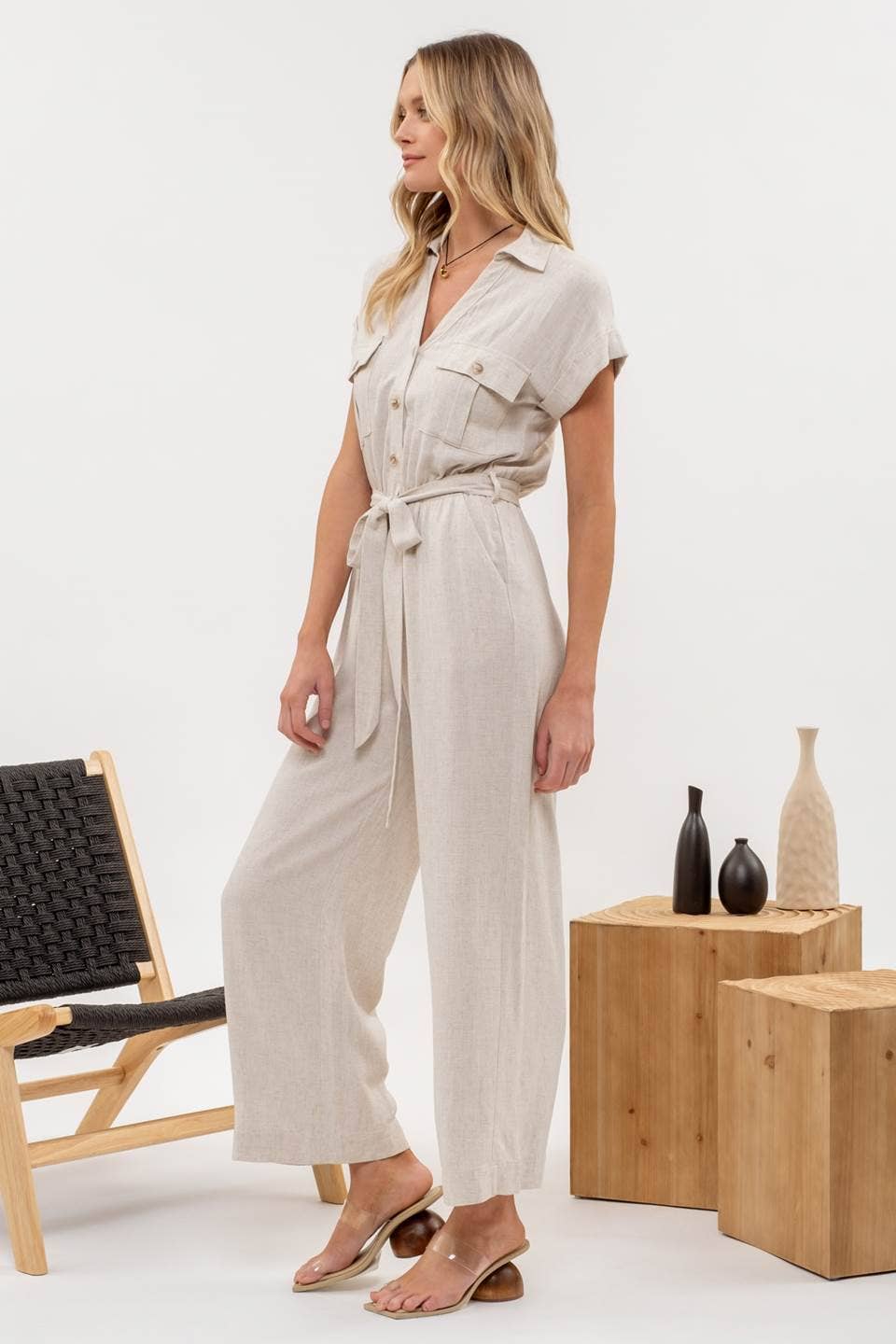  Size chart for Button Down Belted Wide Leg Jumpsuit from J&J Shop Online providing size options and measurements.