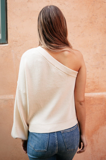 Flat lay of Cross Your Heart Top, back view, available at J&J Shop Online.