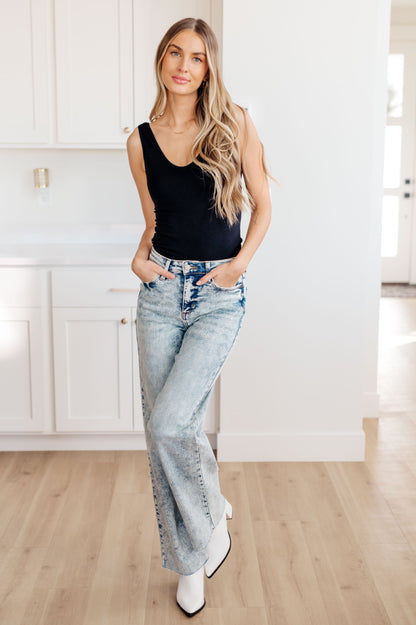 Side view of the Dory High Waist Mineral Wash Raw Hem Wide Leg Jeans by Judy Blue, available at J&J, as seen on Jessica and Juan from 90 Day Fiancé.