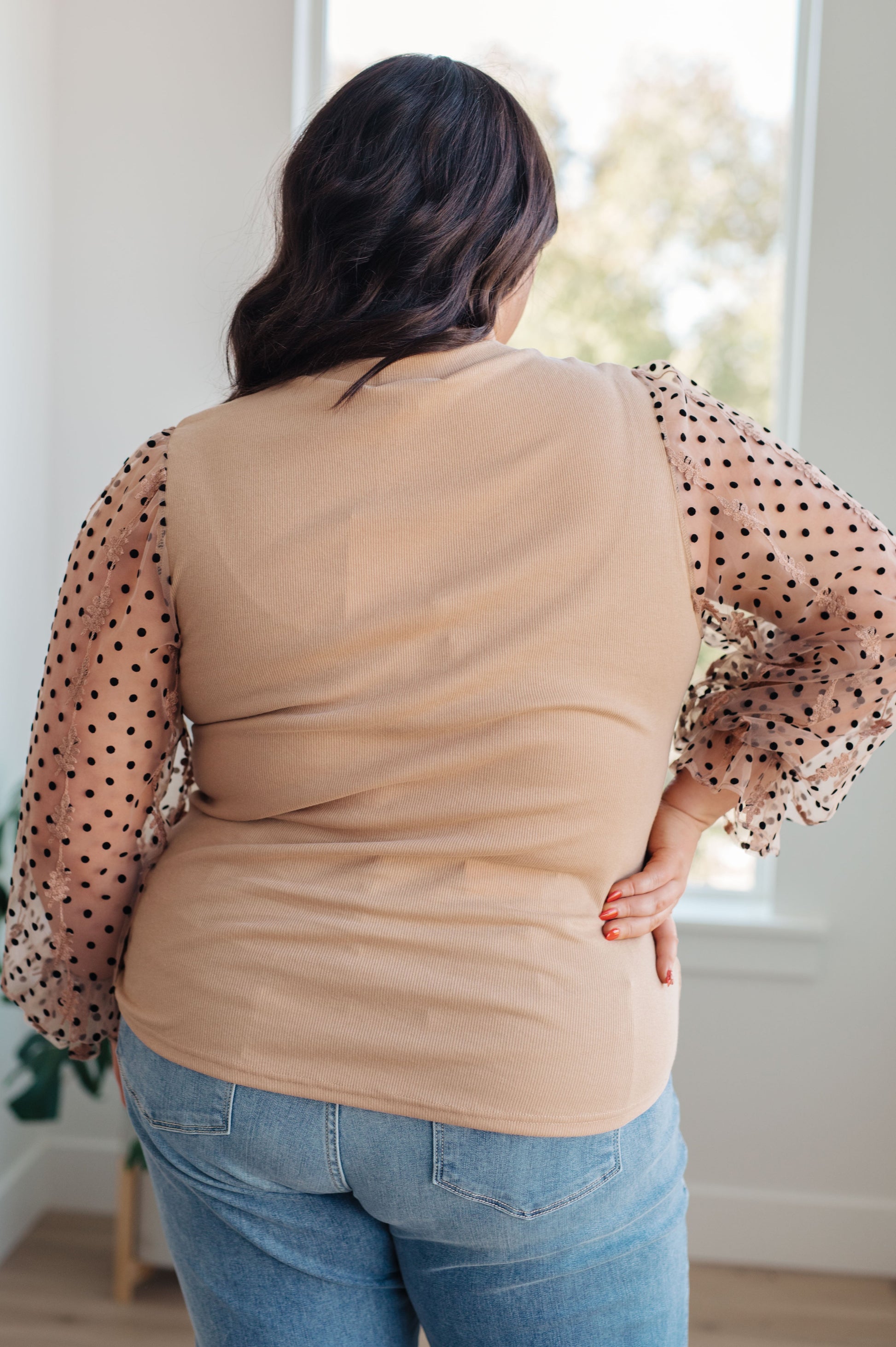 Back close-up of the Dots on My Sleeves Blouse, featuring the ribbed knit body and sheer sleeves, available at J&J, as seen on Jessica and Juan from 90 Day Fiancé.