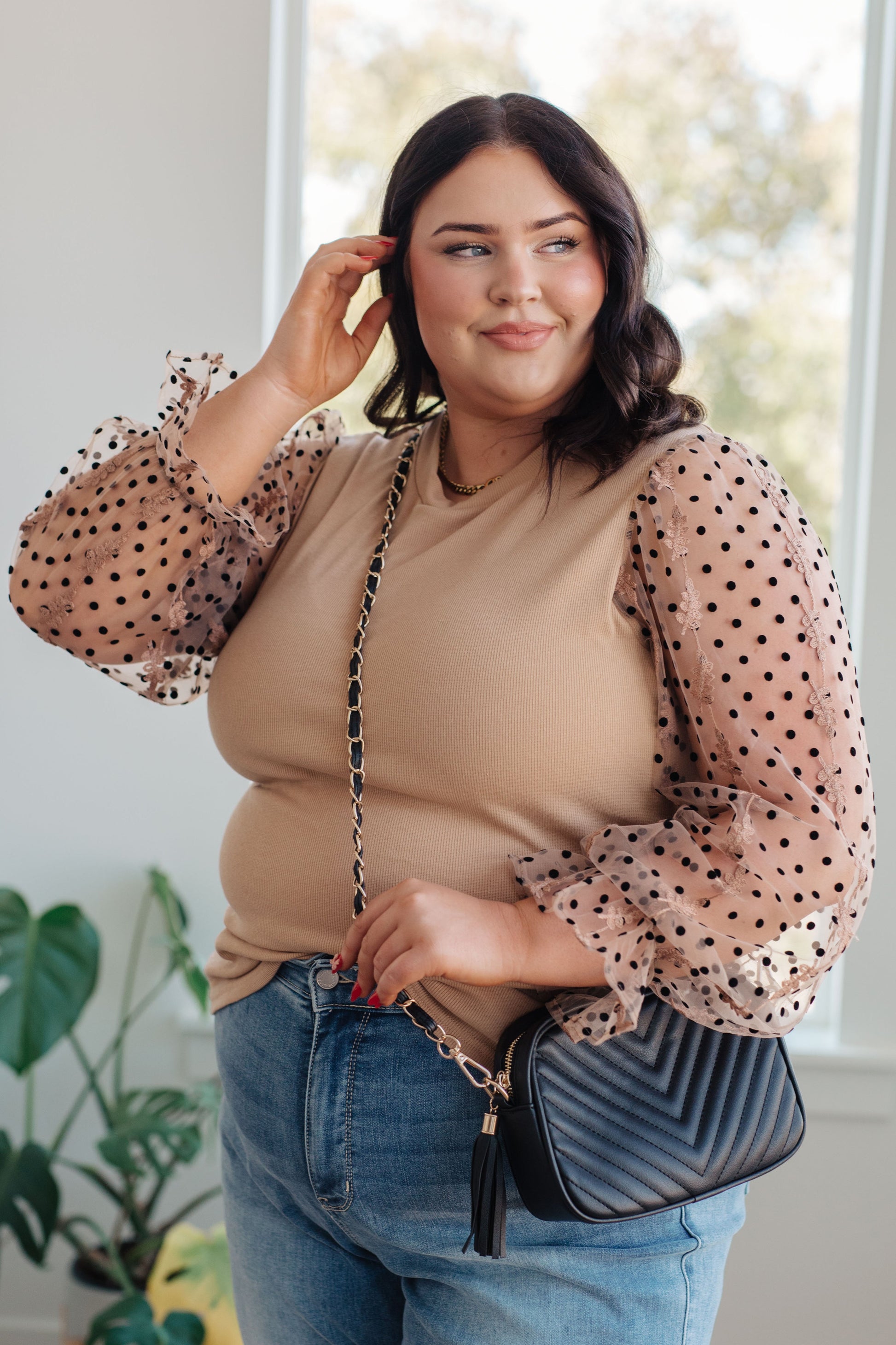 Close-up of the ribbed knit body and round neckline on the Dots on My Sleeves Blouse, available at J&J, as seen on Jessica and Juan from 90 Day Fiancé.