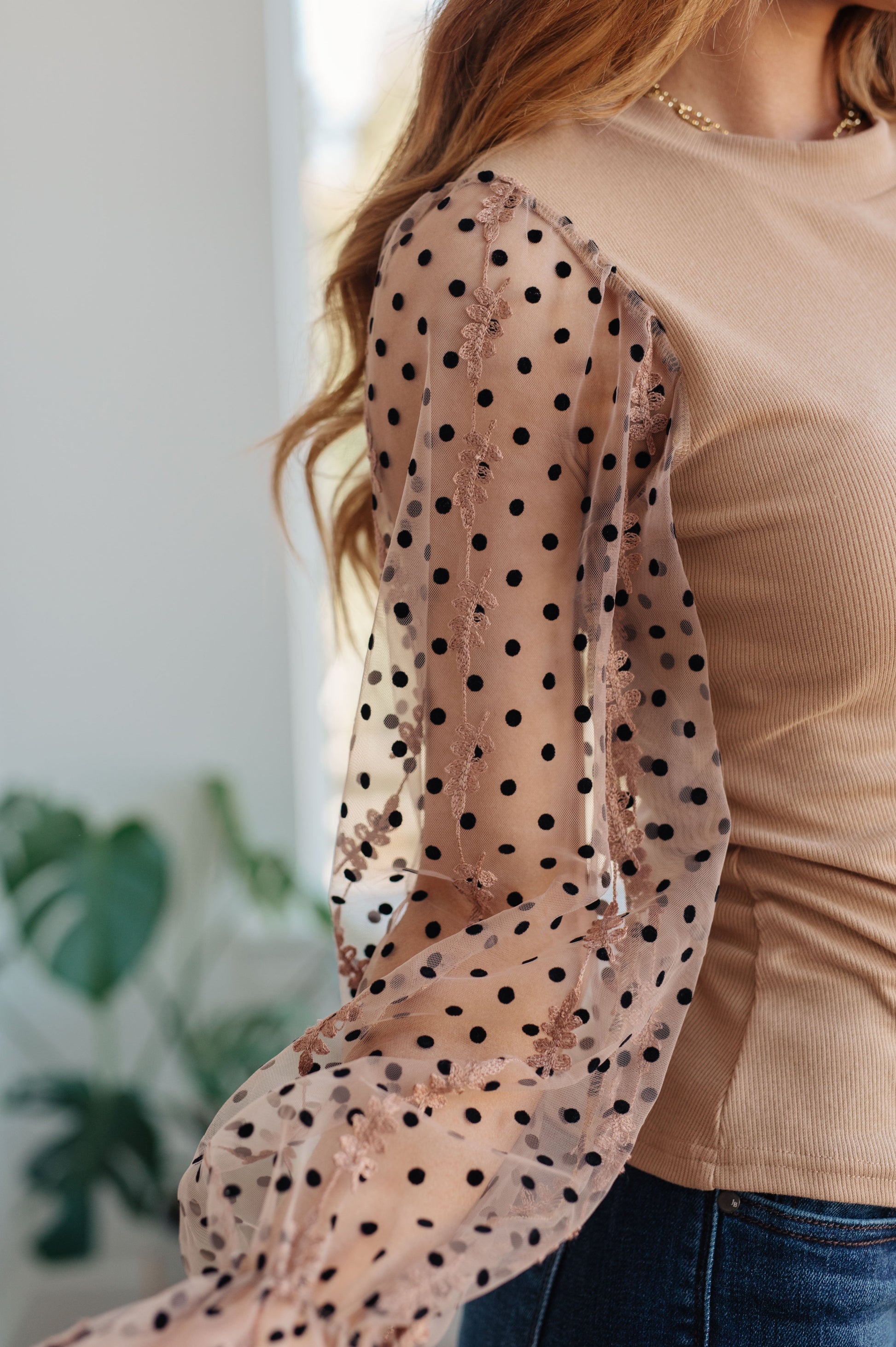 Model wearing the Dots on My Sleeves Blouse, front view, showcasing the slim fit and stylish design, available at J&J, as seen on Jessica and Juan from 90 Day Fiancé.