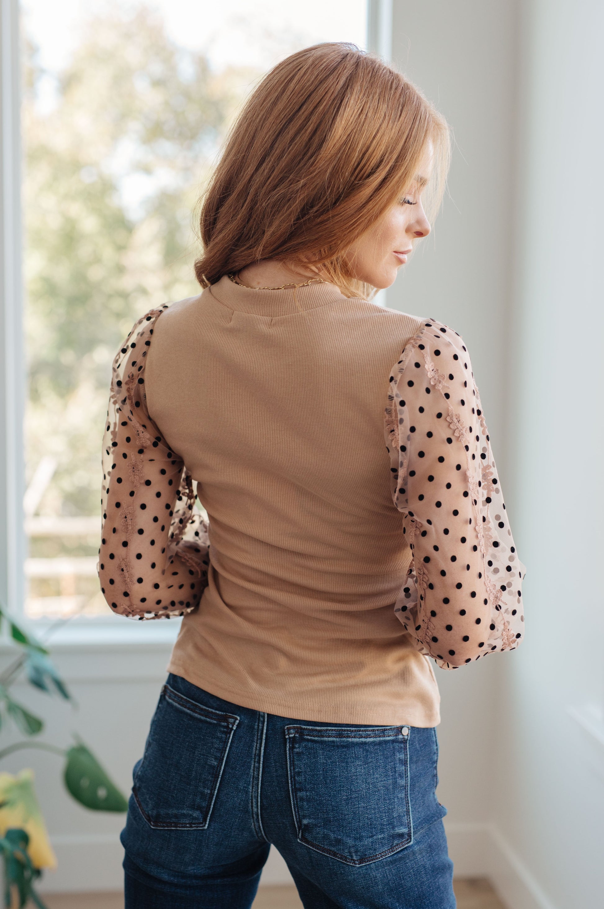 Side close-up of the Dots on My Sleeves Blouse, highlighting the velvet polka dots and embroidered floral pattern on the sleeves, available at J&J, as seen on Jessica and Juan from 90 Day Fiancé.