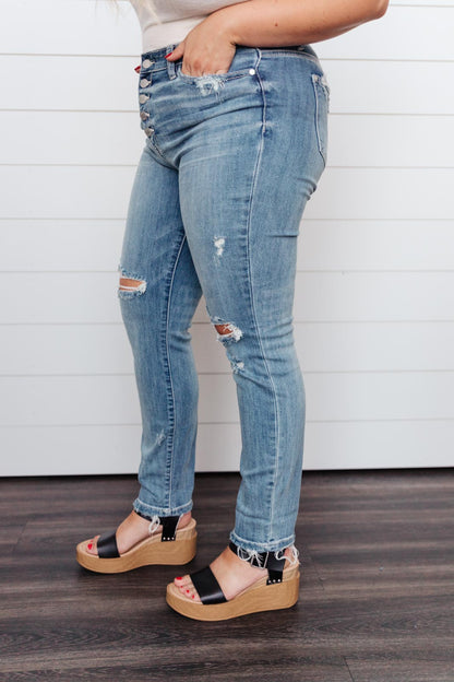 High Waist Button Fly Denim Jean at J&J SHOP ONLINE, designed with distressing and frayed hem for a casual, trendy appearance.