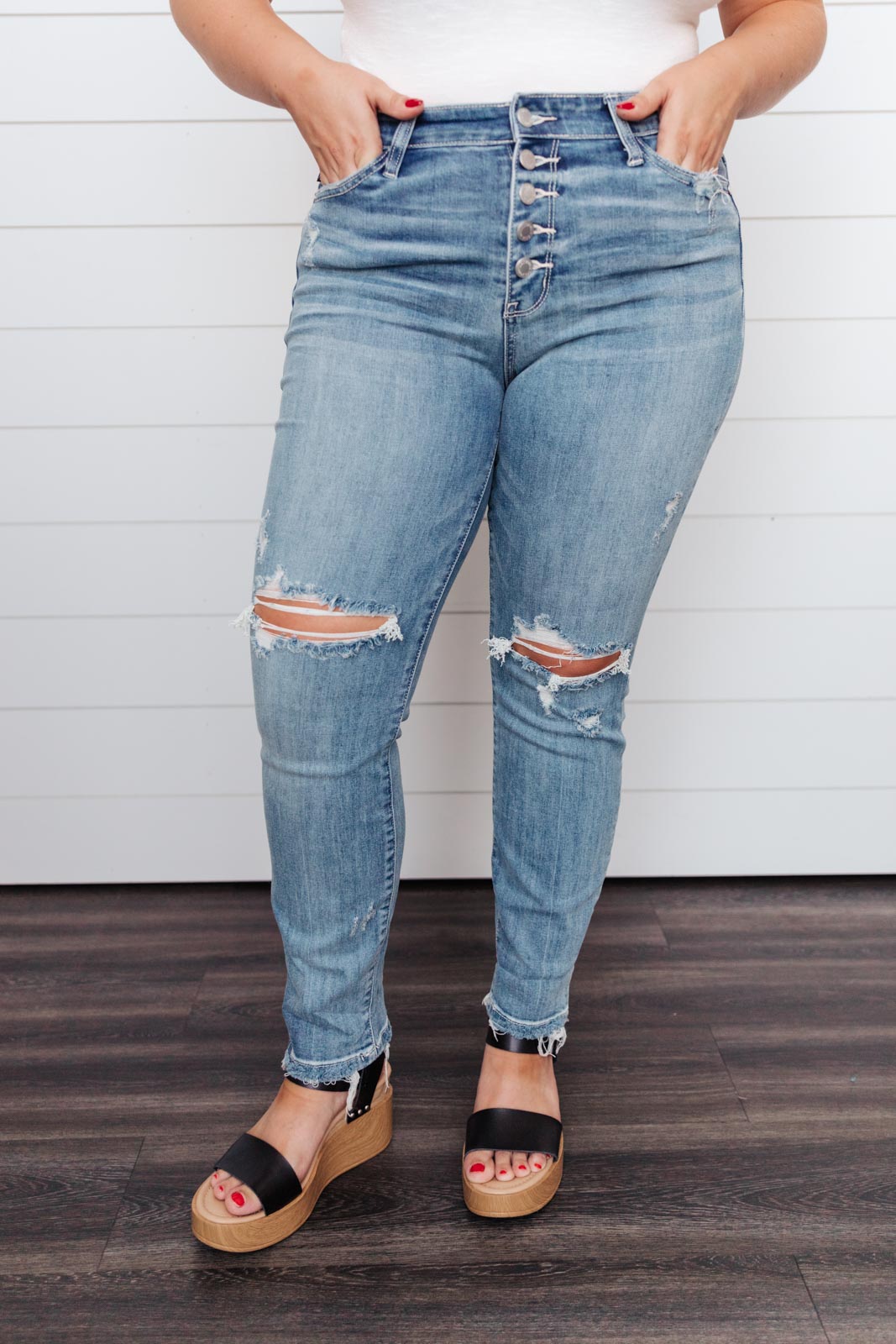 High Waist Denim from J&J SHOP ONLINE with a button fly and knee distressing, offering a casual and stylish boyfriend fit.