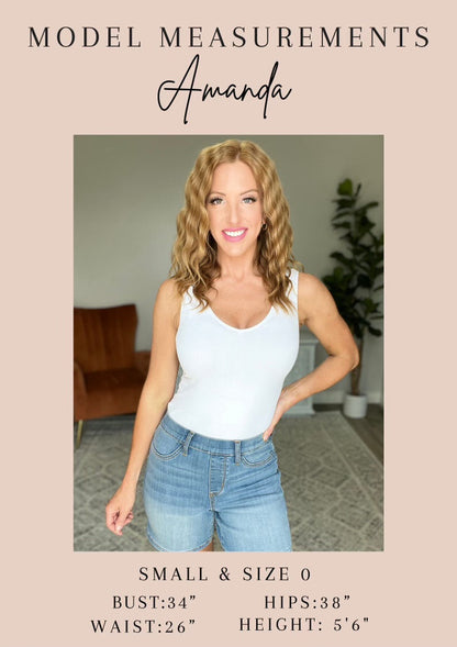 Model Amanda wearing the Muriel Mid Rise Control Top Classic Straight Jeans from J&J Shop Online in size 0/24, demonstrating the jeans' look.