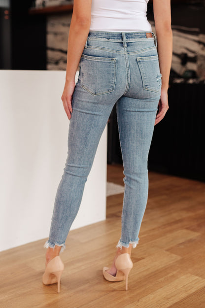 Model Kendall in Sherry Mid Rise Release Waistband Detail Skinny Jeans from J&J SHOP ONLINE, size 15/32, featuring a flattering fit and medium wash.