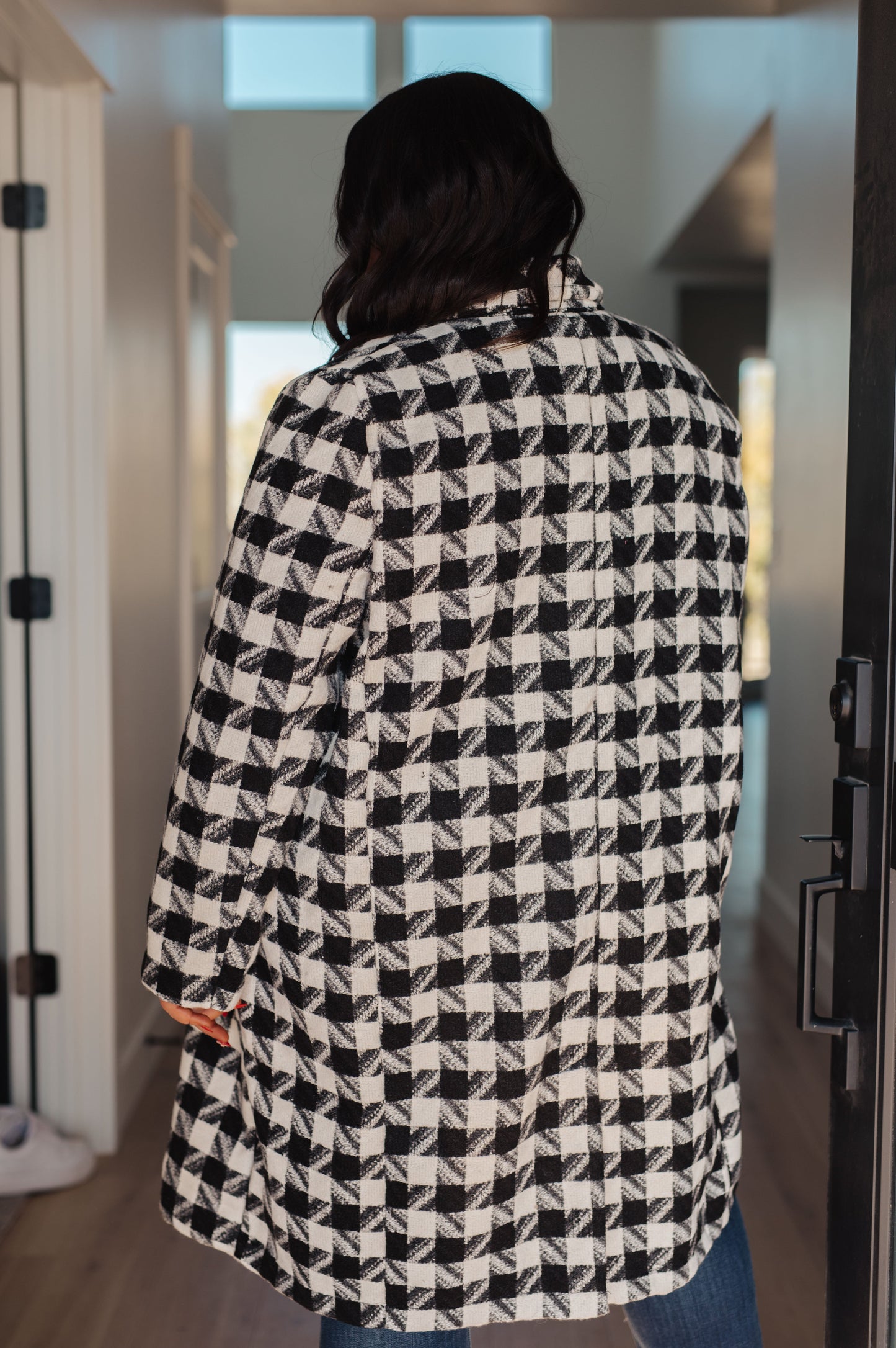 Close-up of the fully lined interior of the Monochromatic Moment Houndstooth Coat from J&J Shop Online.