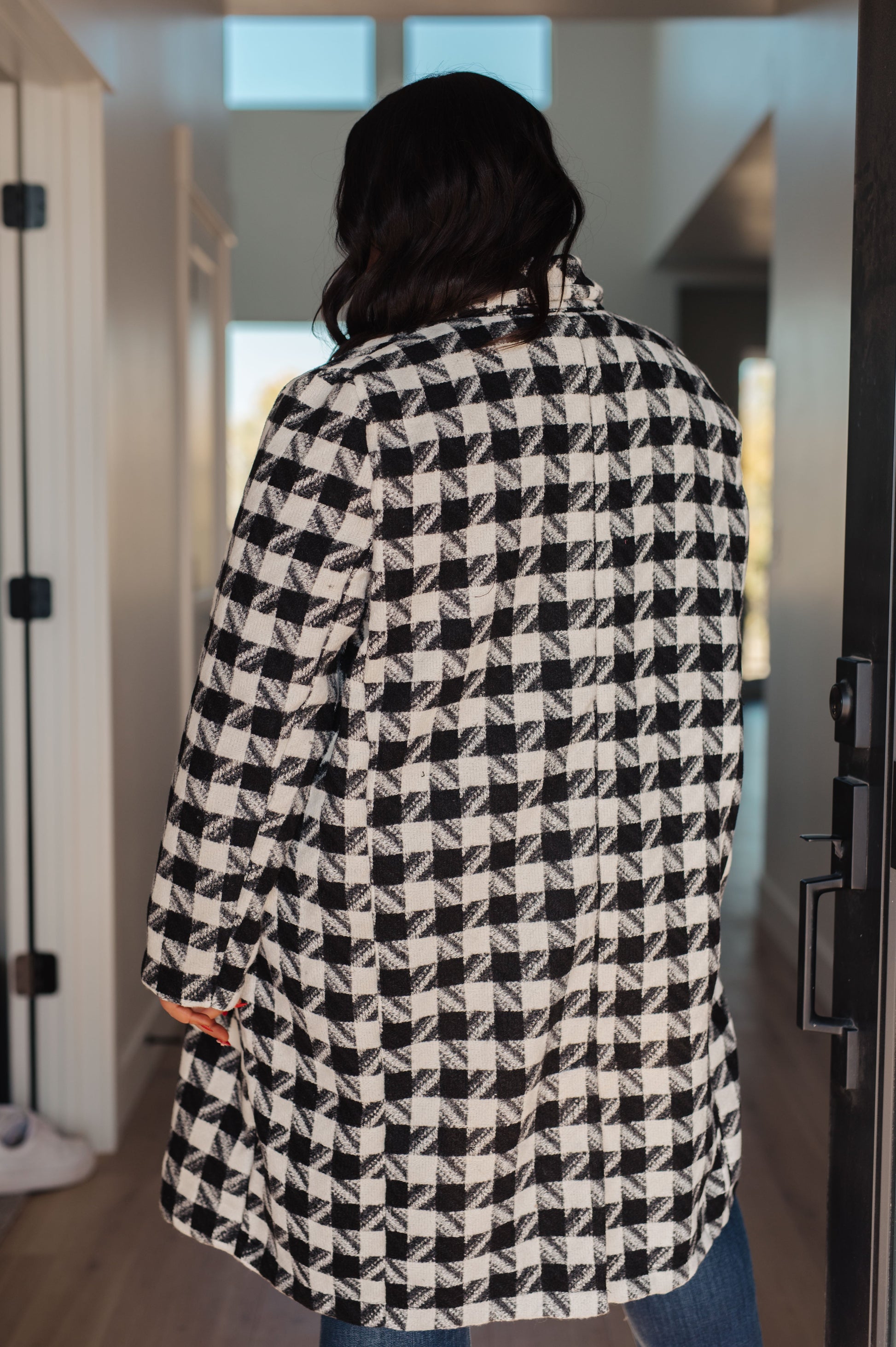 Close-up of the fully lined interior of the Monochromatic Moment Houndstooth Coat from J&J Shop Online.