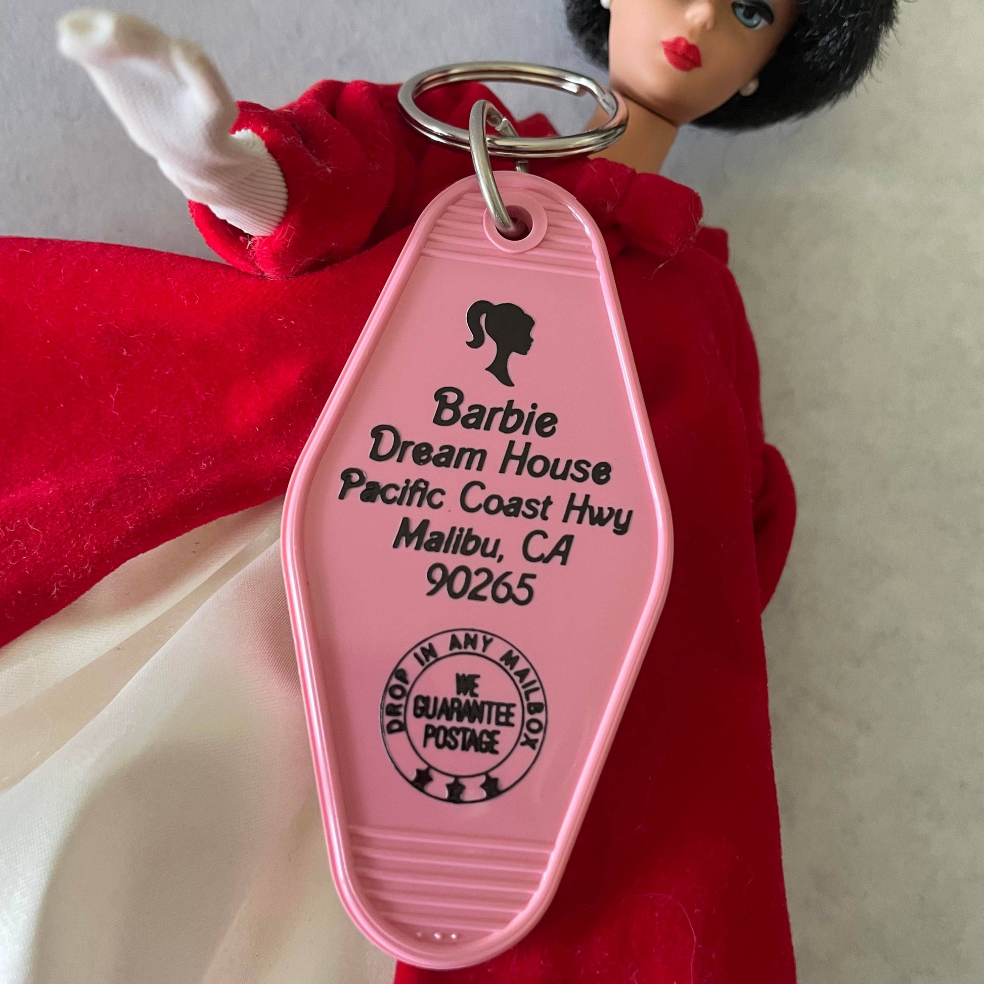 Front view of the Motel Key Fob inspired by the Barbie Dream House from J&J Shop Online, featuring a vibrant design.