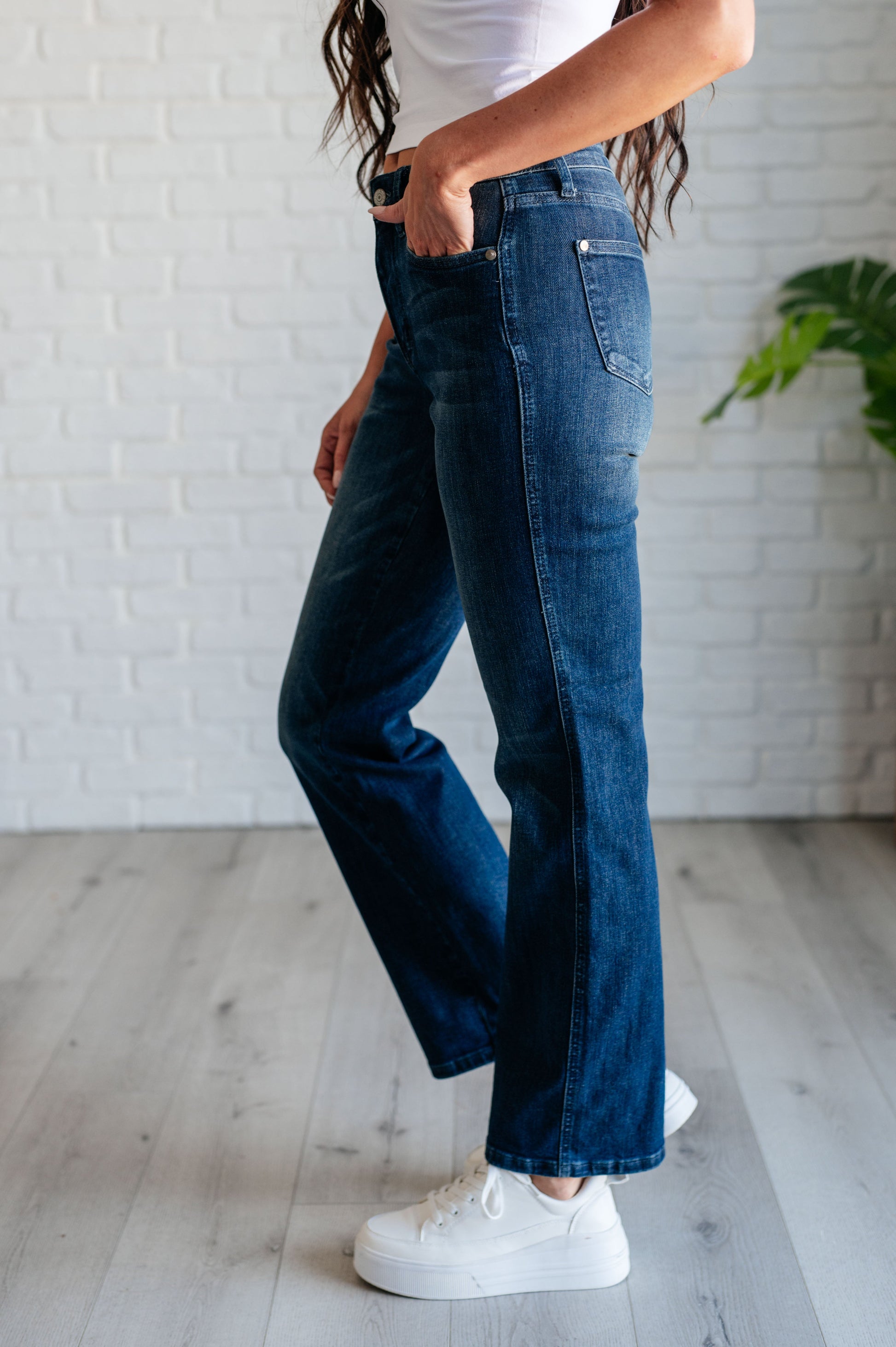 Model standing in the Muriel Mid Rise Control Top Classic Straight Jeans from J&J Shop Online, displaying the jeans' overall look.