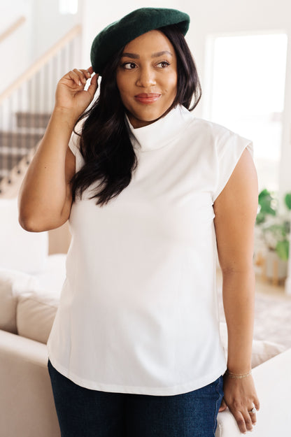 The Overqualified Mock Neck Cap Sleeve Top paired with Octavia High Rise Control Top Skinny Jeans and a Fitted Blazer, suggesting stylish outfit combinations.