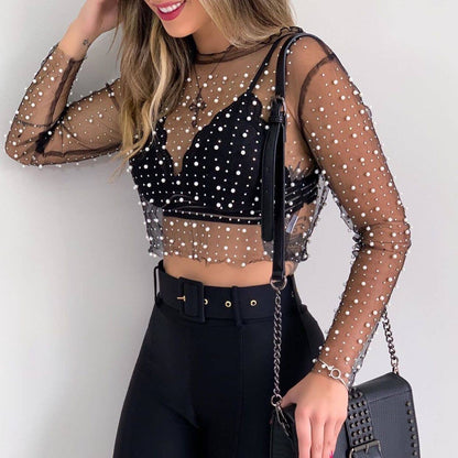 Close-up of the Pearl Rhinestone Studded See-Through Mesh Crop Top fabric, featuring the intricate fake pearl and rhinestone details.