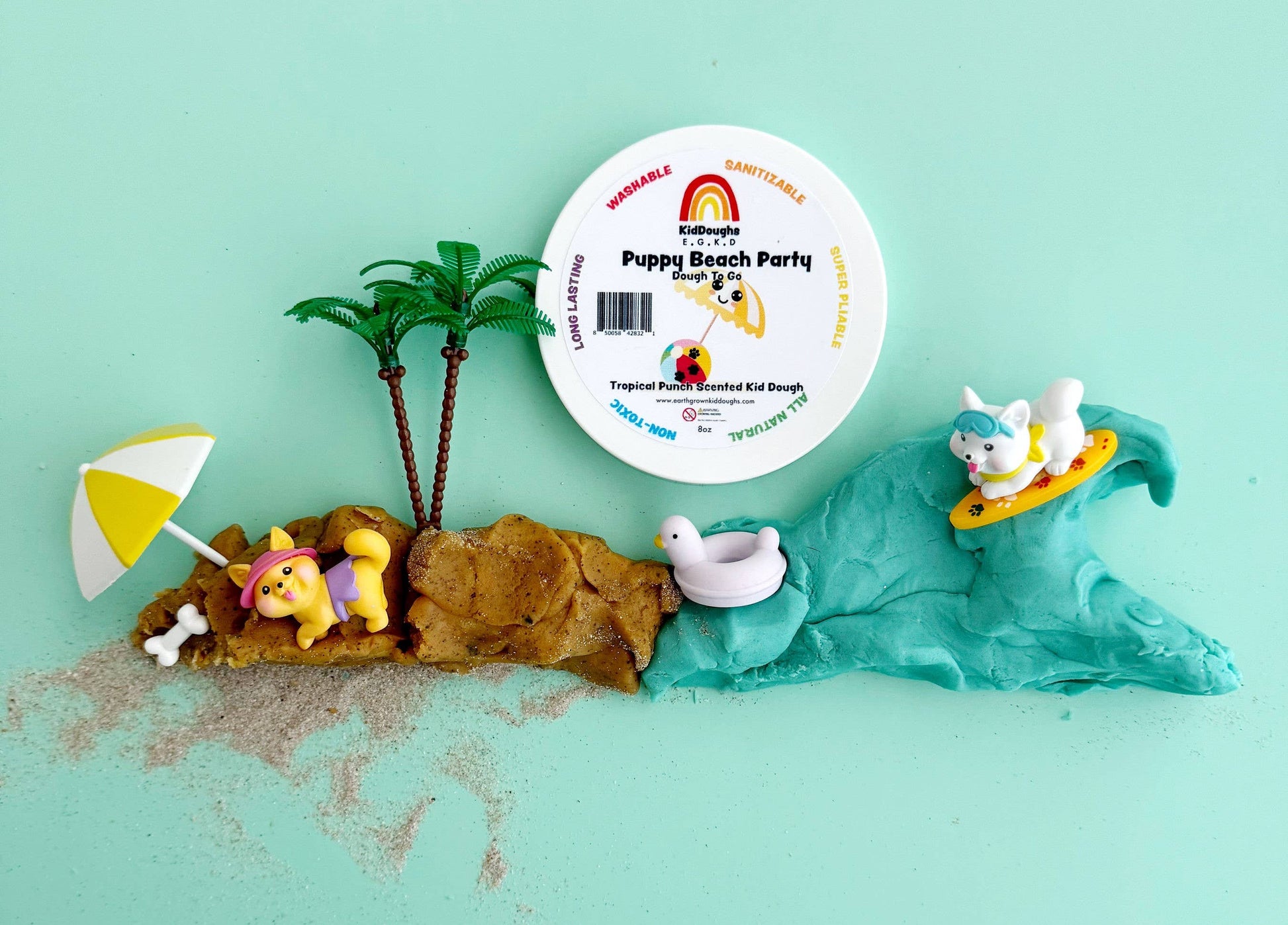 Engaging sensory dough play kit from J&J SHOP ONLINE, including blue and sand-colored dough with beach-themed figures and accessories.