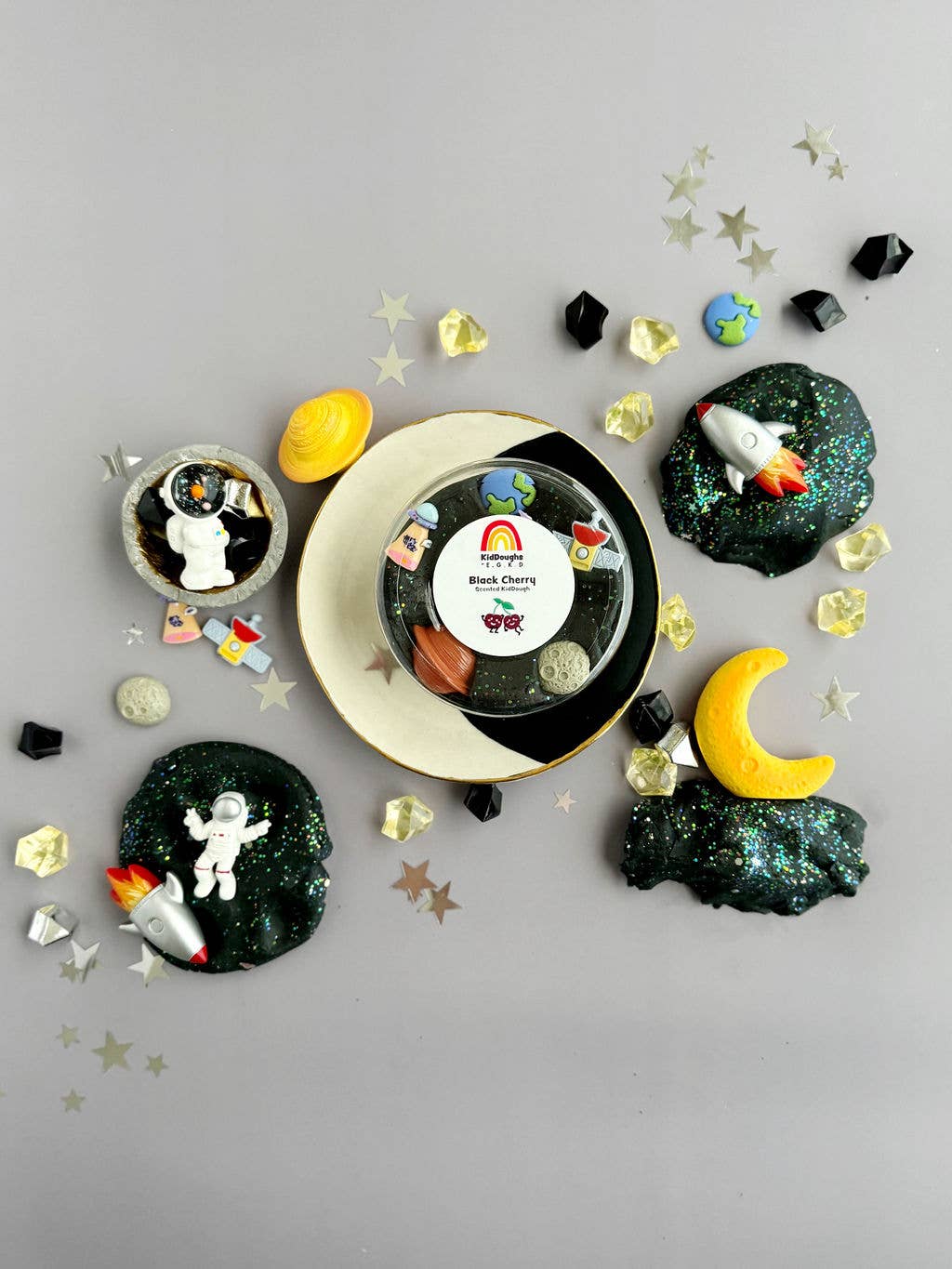 Space-Themed Dough Play Kit from J&J SHOP ONLINE, including Black Cherry KidDough, space-themed figurines, and acrylic space rocks for creative fun.