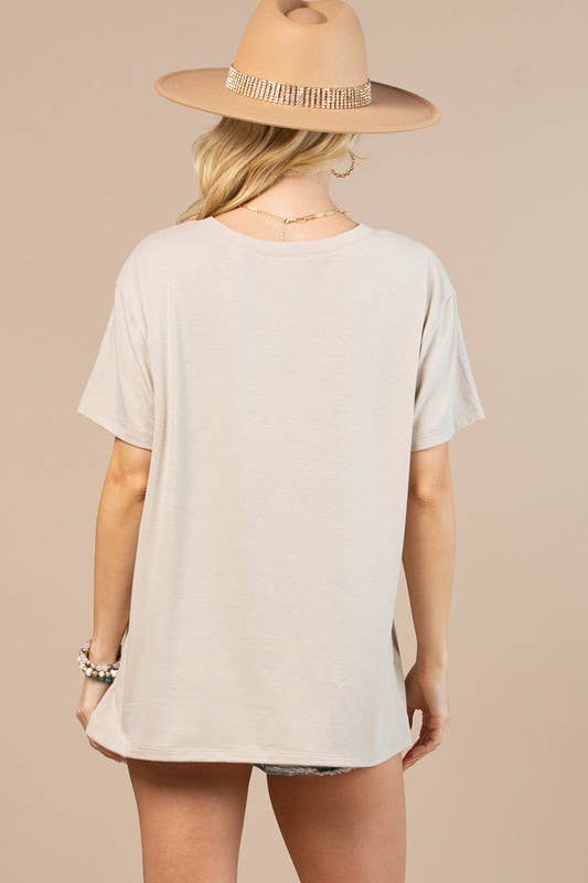 Back view of Western Graphic Basic T-Shirt from J&J Shop Online displaying the shirt’s design and fit.