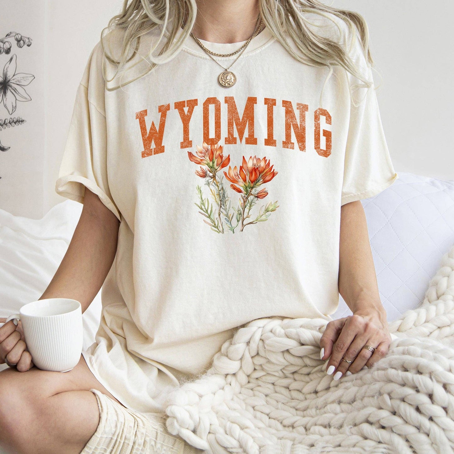 Detail of the Indian Paintbrush graphic on the Wyoming State Flower T-Shirt, highlighting the premium cotton and soft printing technique, from J&J Shop Online.