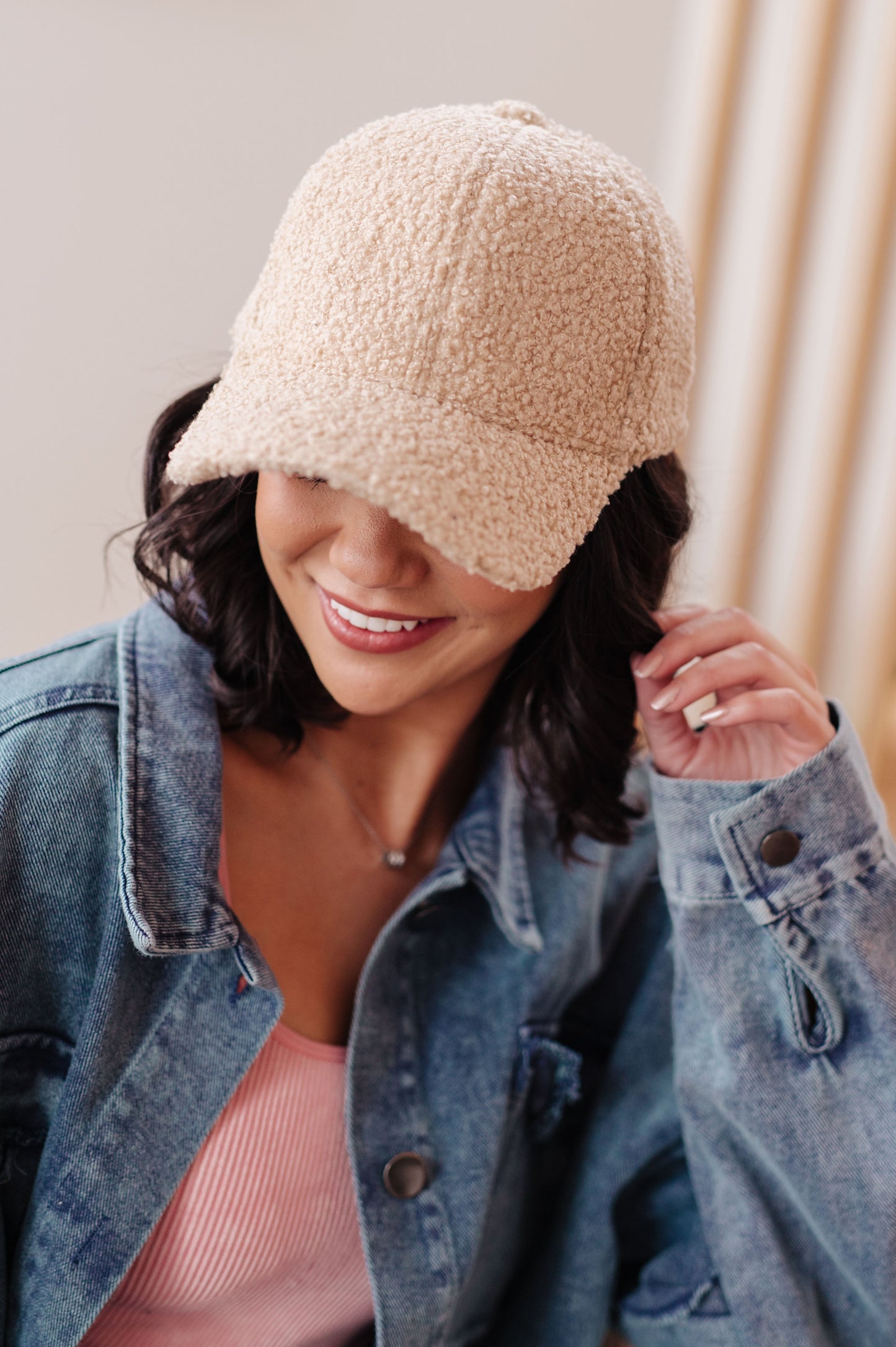 Close-up of the boucle fleece material of the Lyla Sherpa Ball Cap from J&J Shop Online.