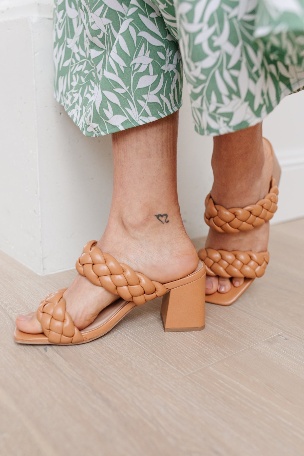 Model wearing Maya Braided Heels in Tan from J&J Shop Online, demonstrating how the sandals complement a summer outfit.