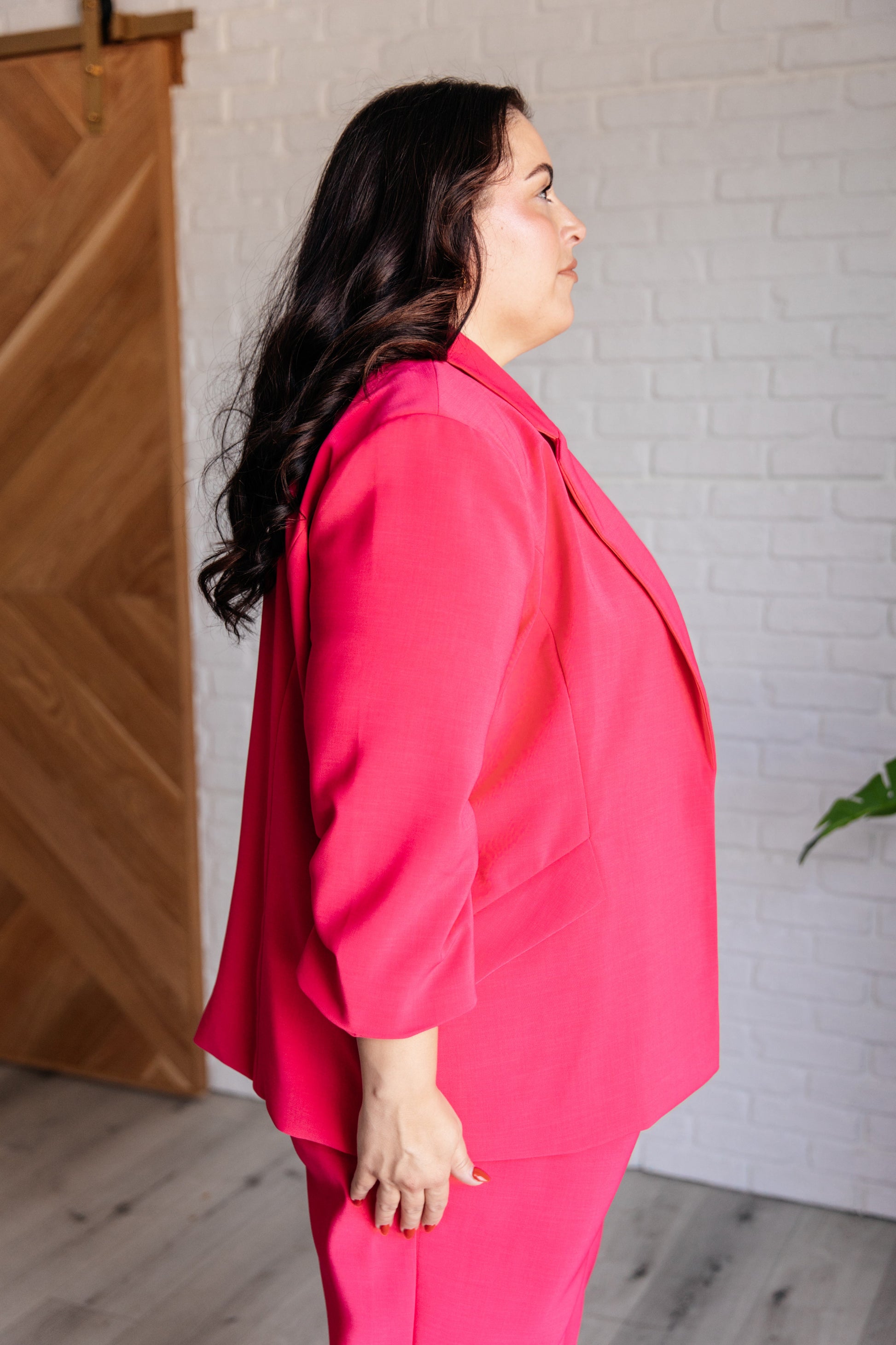 Model Ashley wearing the Vigilante Stuff Blazer in Hot Pink in size 2XL, showcasing the blazer’s flattering fit and vibrant color by J&J Shop.