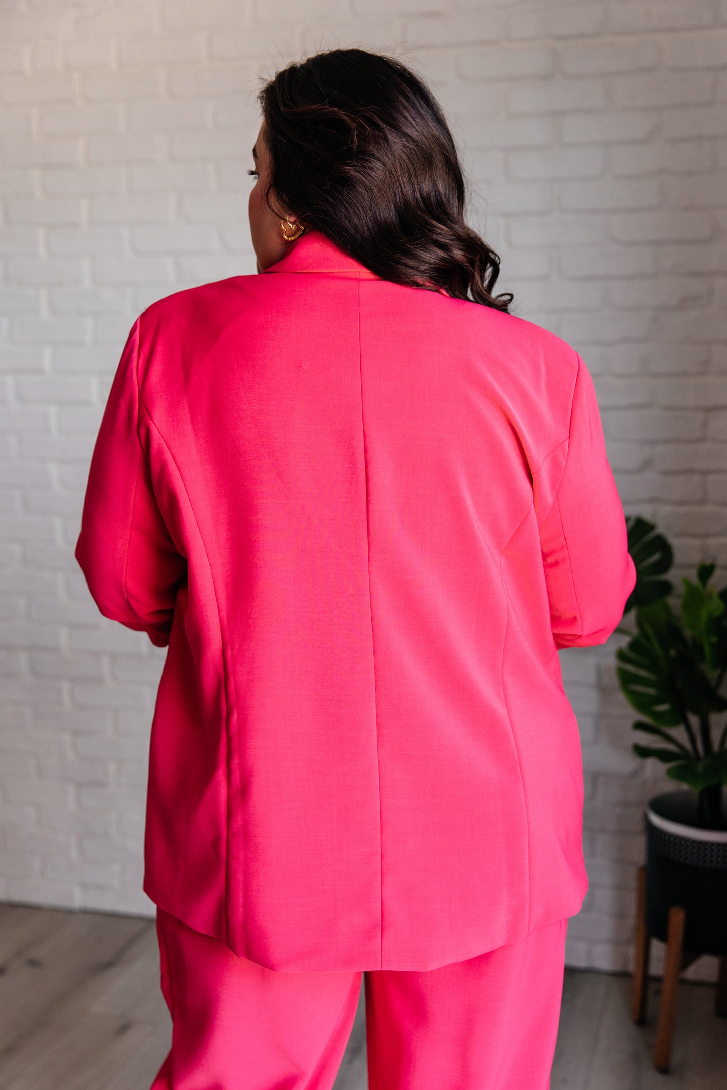 Close-up of the ruched 3/4 sleeves on the Vigilante Stuff Blazer in Hot Pink, showing off the fun and playful design by J&J Shop.