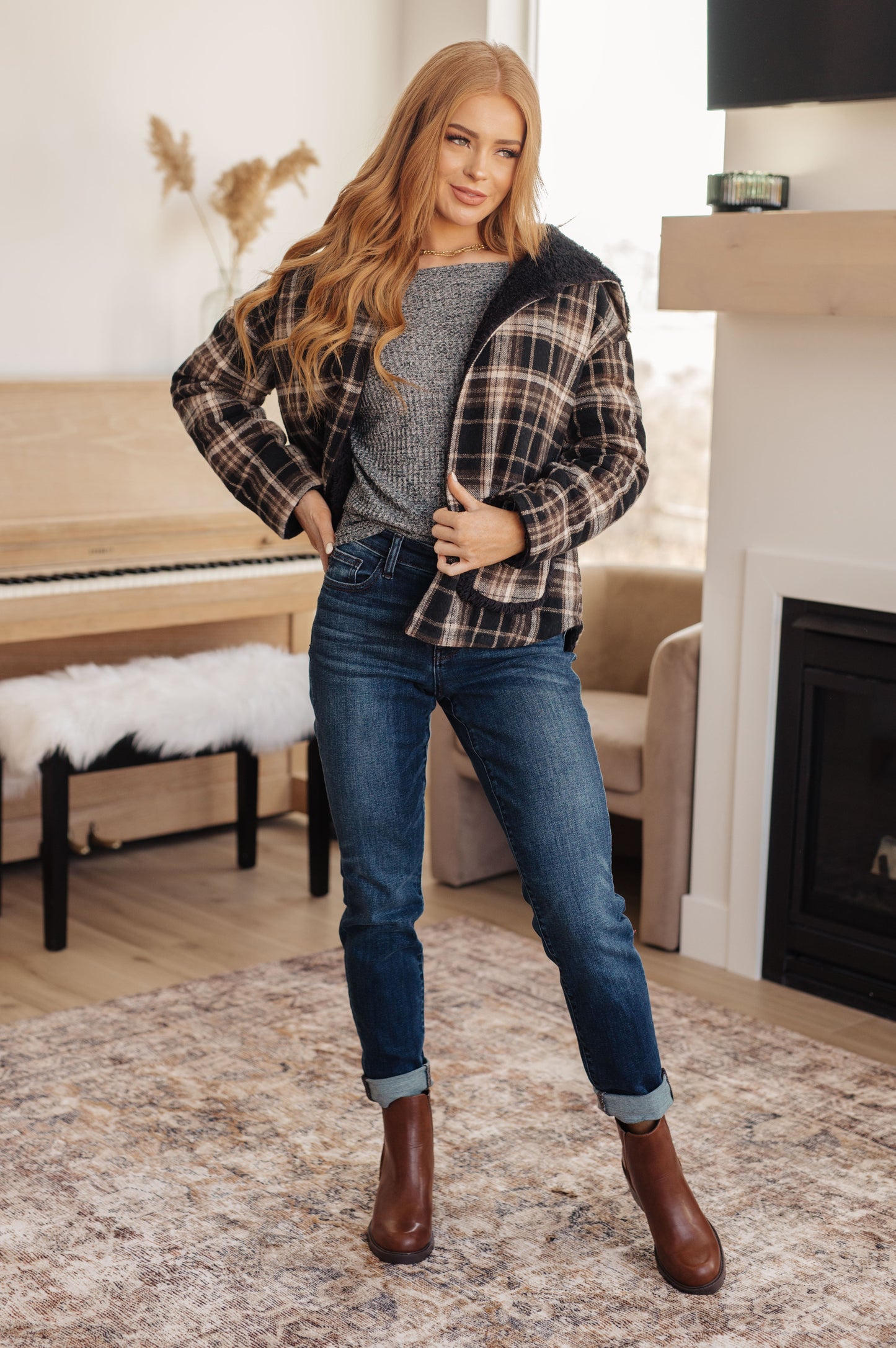 Model Jayci wearing the Warped Noise Reversible Plaid Shacket in size 2XL, showcasing the faux fur side, available at J&J Shop.